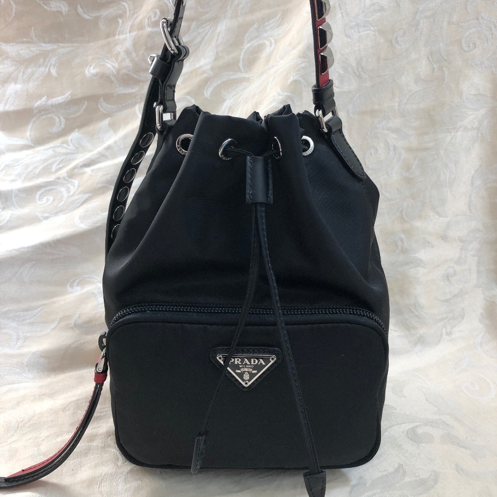 PRADA POCKET BUCKET BAG TESSUTO WITH STUDDED LEATHER